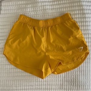 Gymshark yellow running shorts